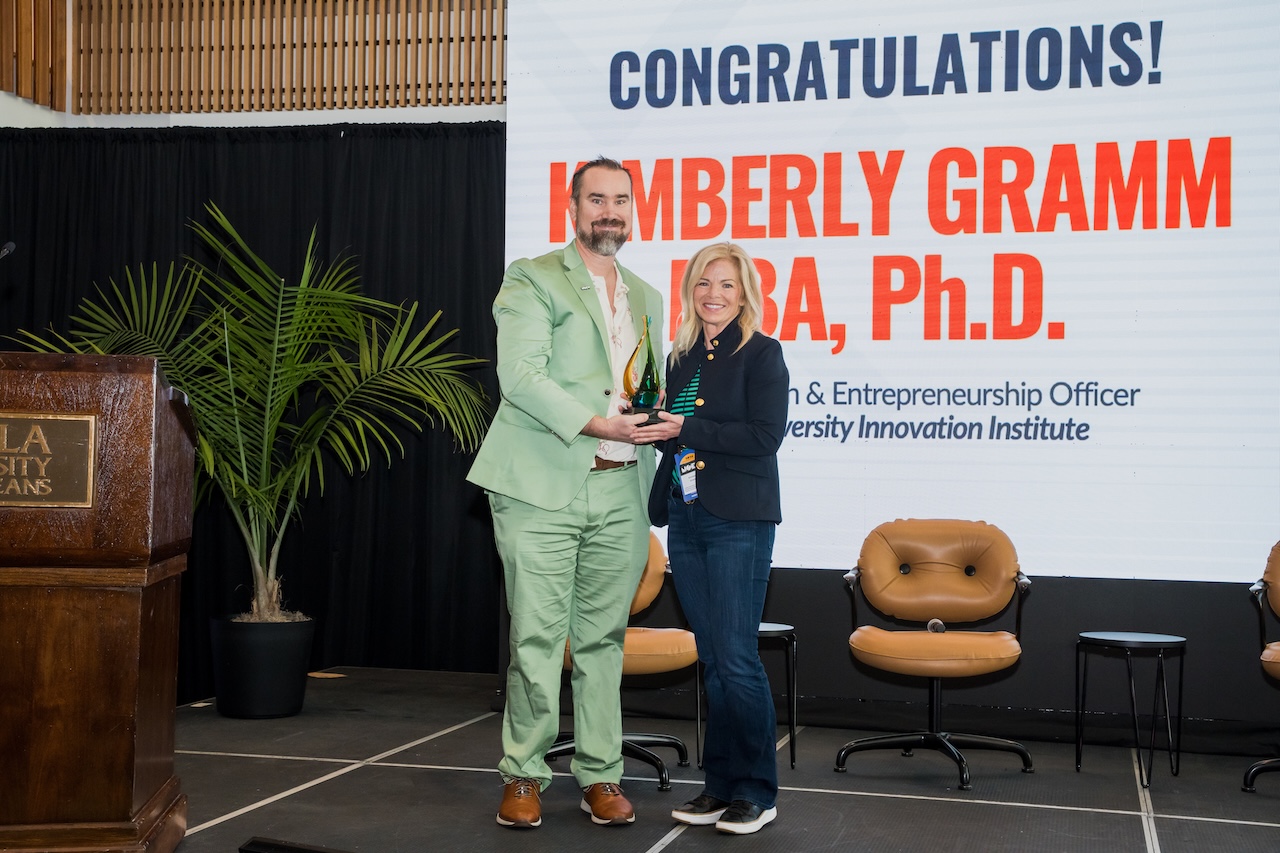 Jon-Atkinson-Presents-Kimberly-Gramm-Idea-Village-Names-1st-Scott-Gale-Memorial-Award-Winner.jpg 